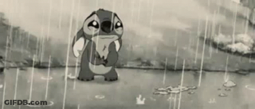 Stitch From Disney 'S Lilo And Stitch Is Crying In The Rain In A Black And White Photo . GIF