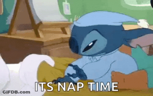 Stitch From Lilo And Stitch Is Laying In Bed Wearing A Nightcap . GIF