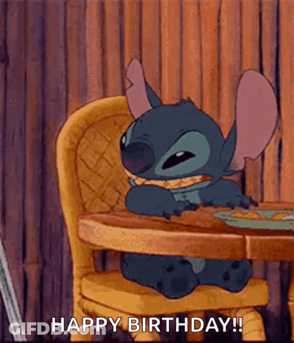 Stitch From Lilo And Stitch Is Sitting At A Table Eating A Sandwich . GIF