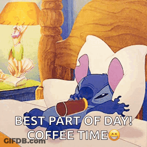 Stitch Is Laying In Bed With A Cup Of Coffee GIF