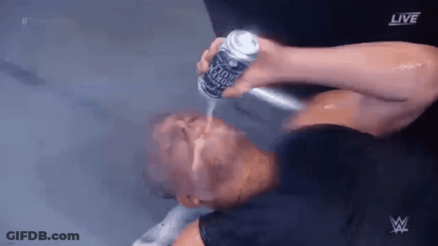 Stone Cold Drinking Beer While Lying Down GIF