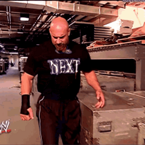 Stone Cold Facing Bill Goldberg GIF