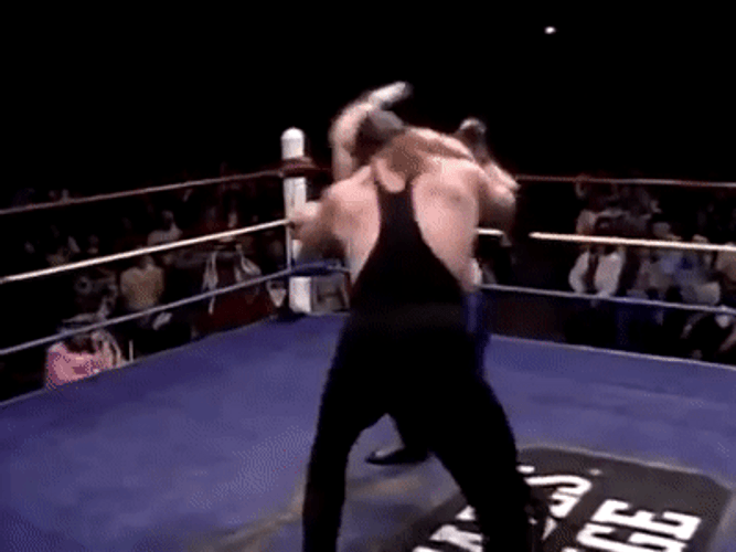 Stone Cold Locking Opponent's Neck GIF
