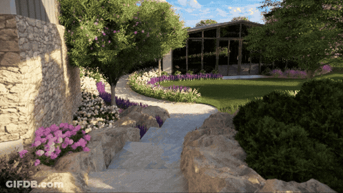 Stone Walkway To House With Purple Flowers And Trees GIF