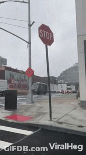 Stop Sign On Street With Viralhog Logo GIF