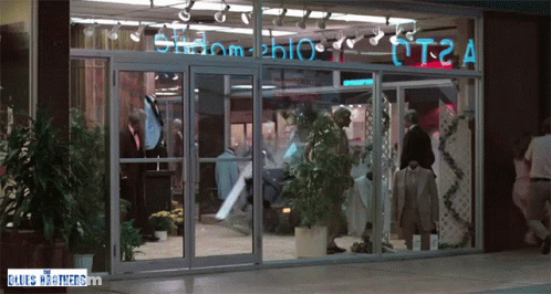 Store Front With Blues Brothers Sign GIF