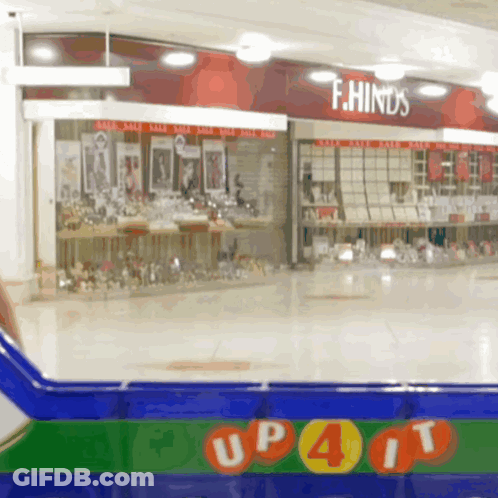 Store With Red Sign Saying F.Hinds GIF
