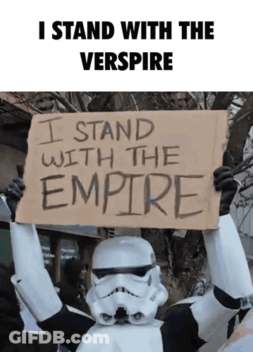 Stormtrooper Holding Sign Saying I Stand With The Empire GIF