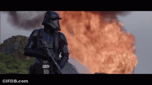 Stormtrooper Standing In Front Of Fire GIF
