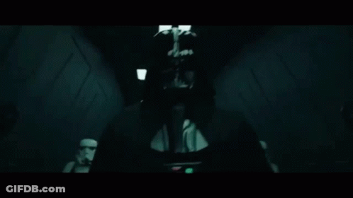 Stormtroopers And Darth Vader Standing GIF