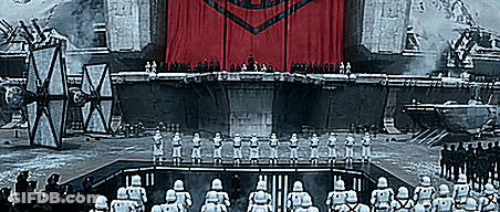 Stormtroopers Standing In Front Of Red Flag GIF