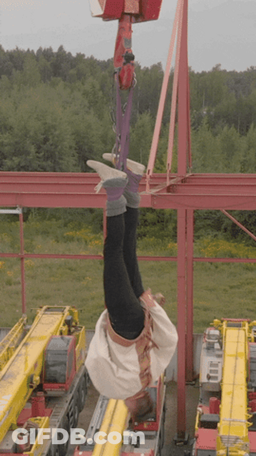 Straight Jacket Hanging Upside Down GIF