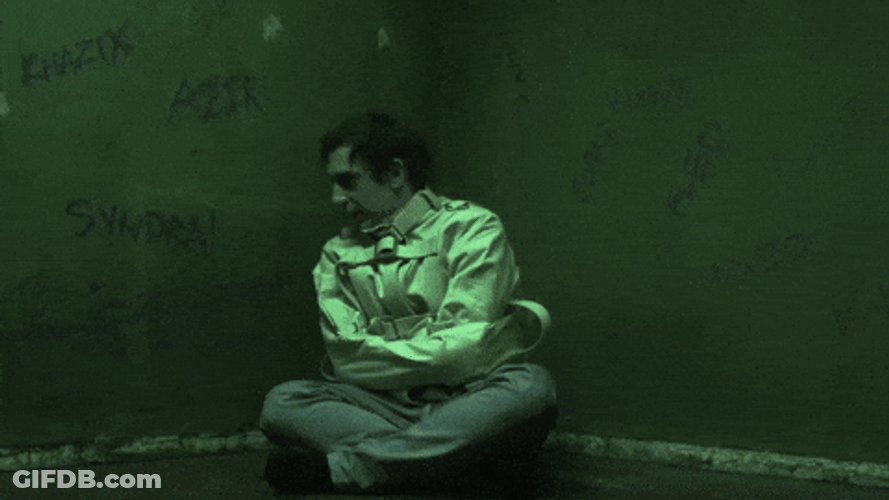 Straight Jacket Man Talking To Himself GIF