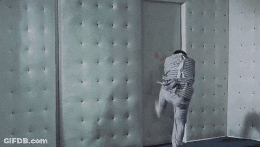 Straight Jacket Trying To Escape The Room GIF
