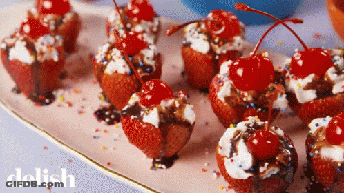 Strawberry Cupcakes With Cherries And Whipped Cream GIF