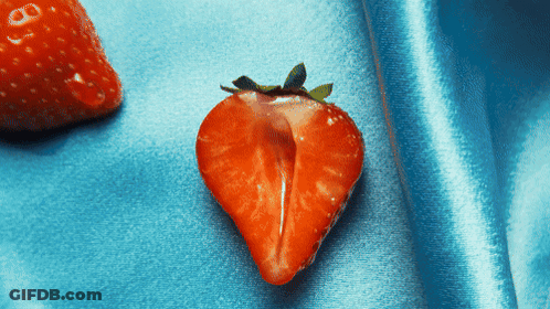 Strawberry Cut In Half On Blue Surface GIF