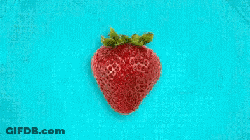 Strawberry Surrounded By Lemon And Grapefruit Slices On Blue GIF