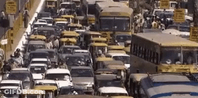 Street With Cars Buses And Ambulance Sign GIF