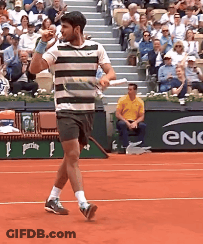 Striped Shirt Man On Tennis Court With Enc Banner GIF