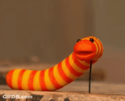 Striped Worm Sticking Out Of Wall GIF