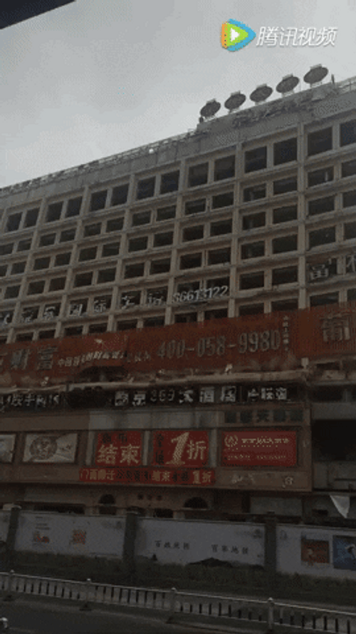 Structure Implosion While Vehicles Pass By GIF