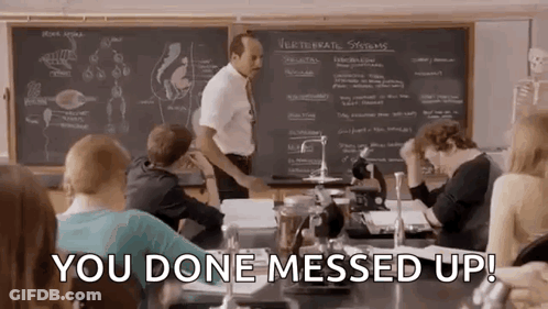Students Sitting In Classroom With Teacher At Chalkboard GIF