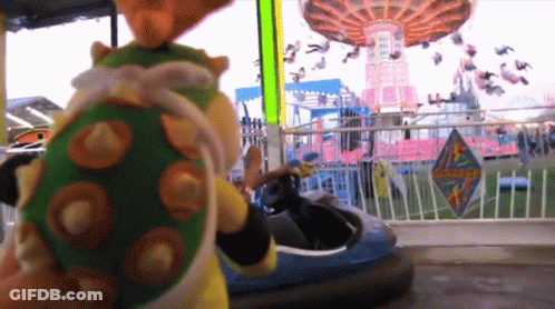 Stuffed Animal By Bumper Car At Amusement Park GIF