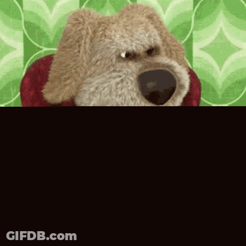 Stuffed Animal Dog Holding Remote GIF