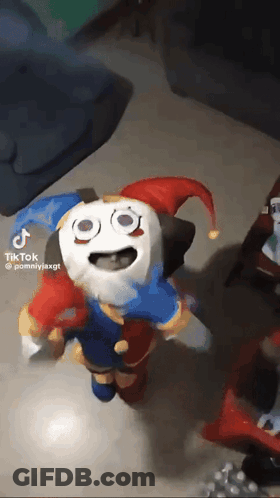 Stuffed Animal Dressed As Jester Standing GIF