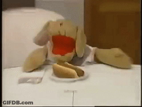 Stuffed Animal Eating Hot Dog With Ketchup GIF