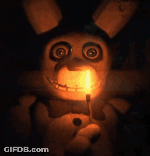 Stuffed Animal Holding Candle In Mouth GIF