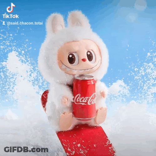 Stuffed Animal Holding Coca Cola Can On Snowboard GIF