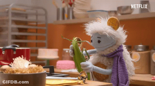 Stuffed Animal Holding Corn On The Cob GIF
