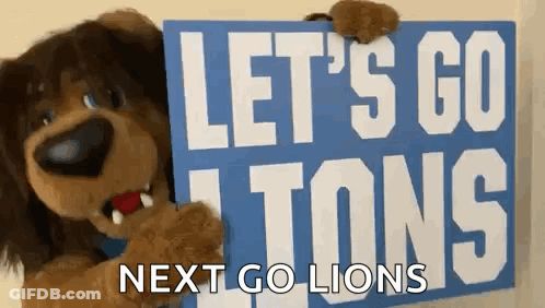 Stuffed Animal Holding Sign Let's Go Tons Next Go Lions GIF