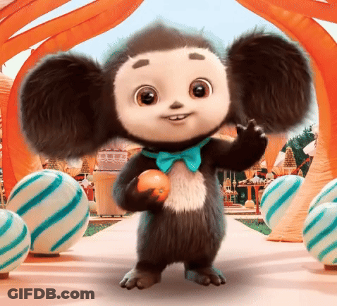 Stuffed Animal In Blue Bow Tie Holding Orange GIF