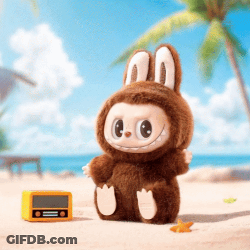 Stuffed Animal In Bunny Costume Next To Yellow Radio GIF