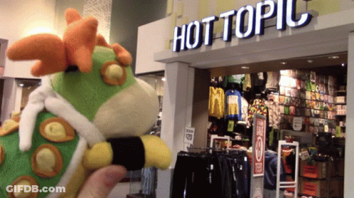 Stuffed Animal In Front Of Hot Topic GIF