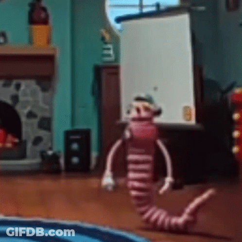 Stuffed Animal In Living Room With Fireplace GIF