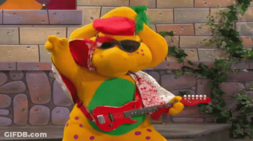 Stuffed Animal In Sunglasses And Red Hat Playing Red Guitar GIF