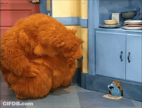 Stuffed Animal Looking Through Hole In Wall GIF
