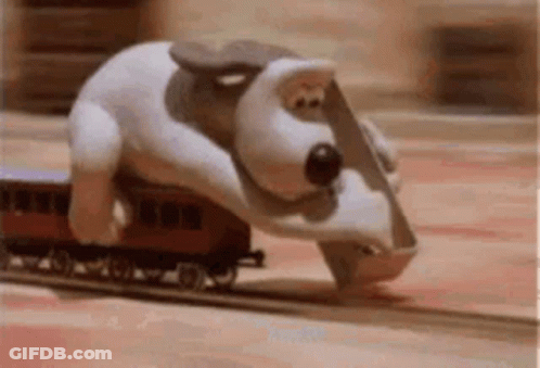 Stuffed Animal Riding On Back Of Train GIF