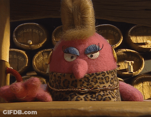 Stuffed Animal Sitting By Ginger Beer Barrels GIF