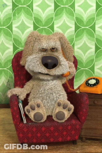 Stuffed Animal Sitting In Red Chair Talking On Phone GIF