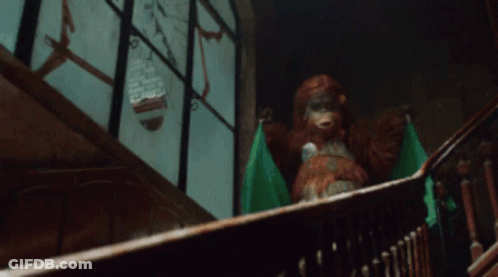Stuffed Animal Sitting On Staircase GIF