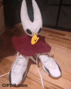 Stuffed Animal Sitting On White Sneakers GIF