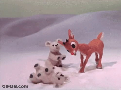 Stuffed Animal Standing Next To Stuffed Animal Laying In Snow GIF