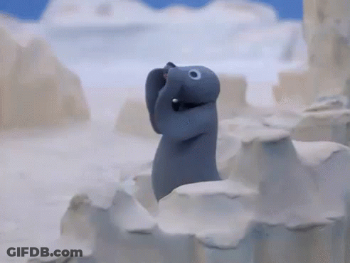 Stuffed Animal Standing On Snow Covered Iceberg GIF