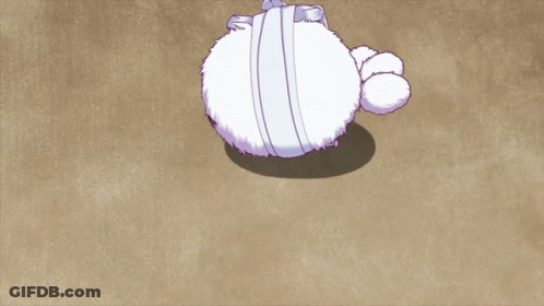 Stuffed Animal With Bandage Around Head Laying On Ground GIF