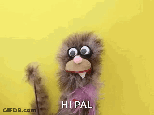 Stuffed Animal With Big Eyes And Purple Tail Waving GIF