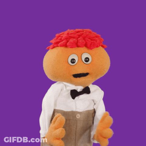 Stuffed Animal With Big Eyes And Red Hair In Tuxedo GIF